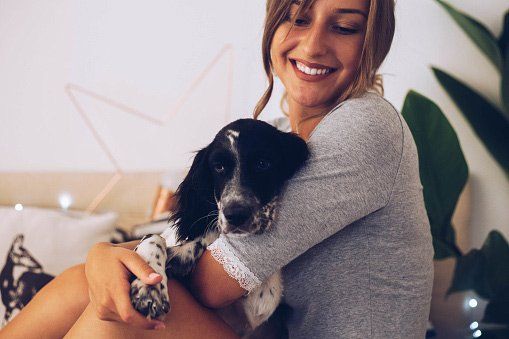 Pet Friendly Apartments and Houses — Woman Holding a Dog in Pleasanton, CA