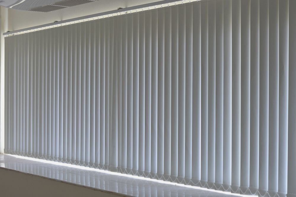 White Vertical Blinds Covering a Large Window — LeSands Screens & Blinds Moss Vale Pty Ltd in Mittagong, NSW