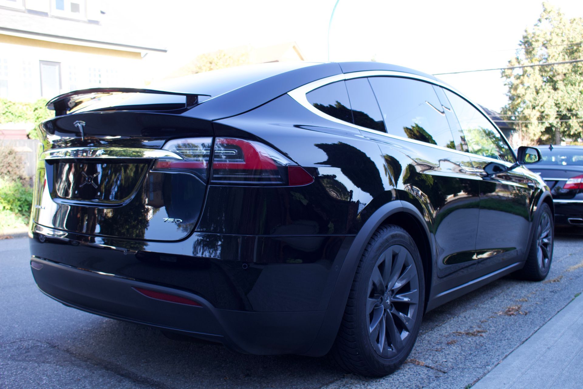 Black Tesla Model X from behind