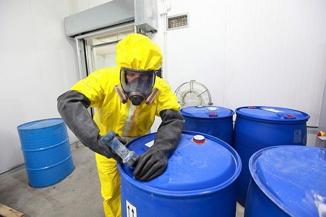 Man Sealing a Drum – Hazardous Waste Removal in Denver, CO