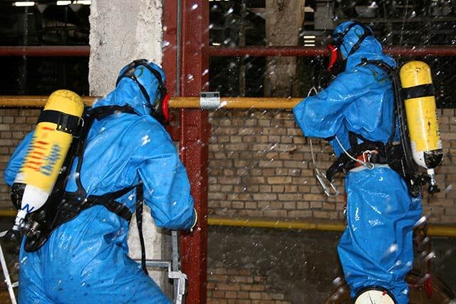 Spraying Asbestos on the Railings – Asbestos Abatement in Denver, CO