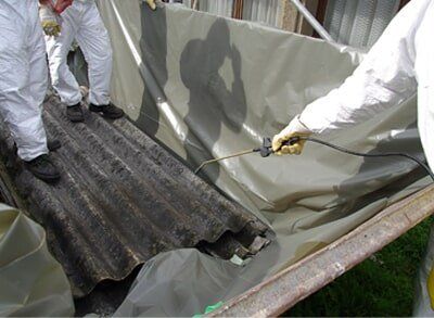 Asbestos Corrugated Roofing Sheet Being Removed and Sealed – Asbestos Abatement in Denver, CO