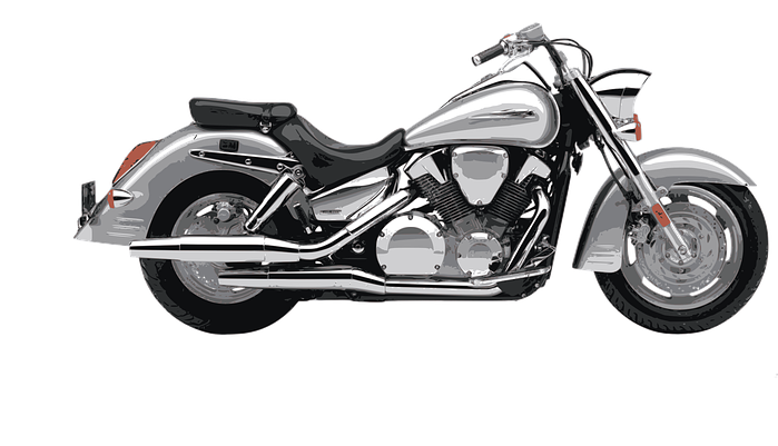 A silver and black motorcycle on a white background.