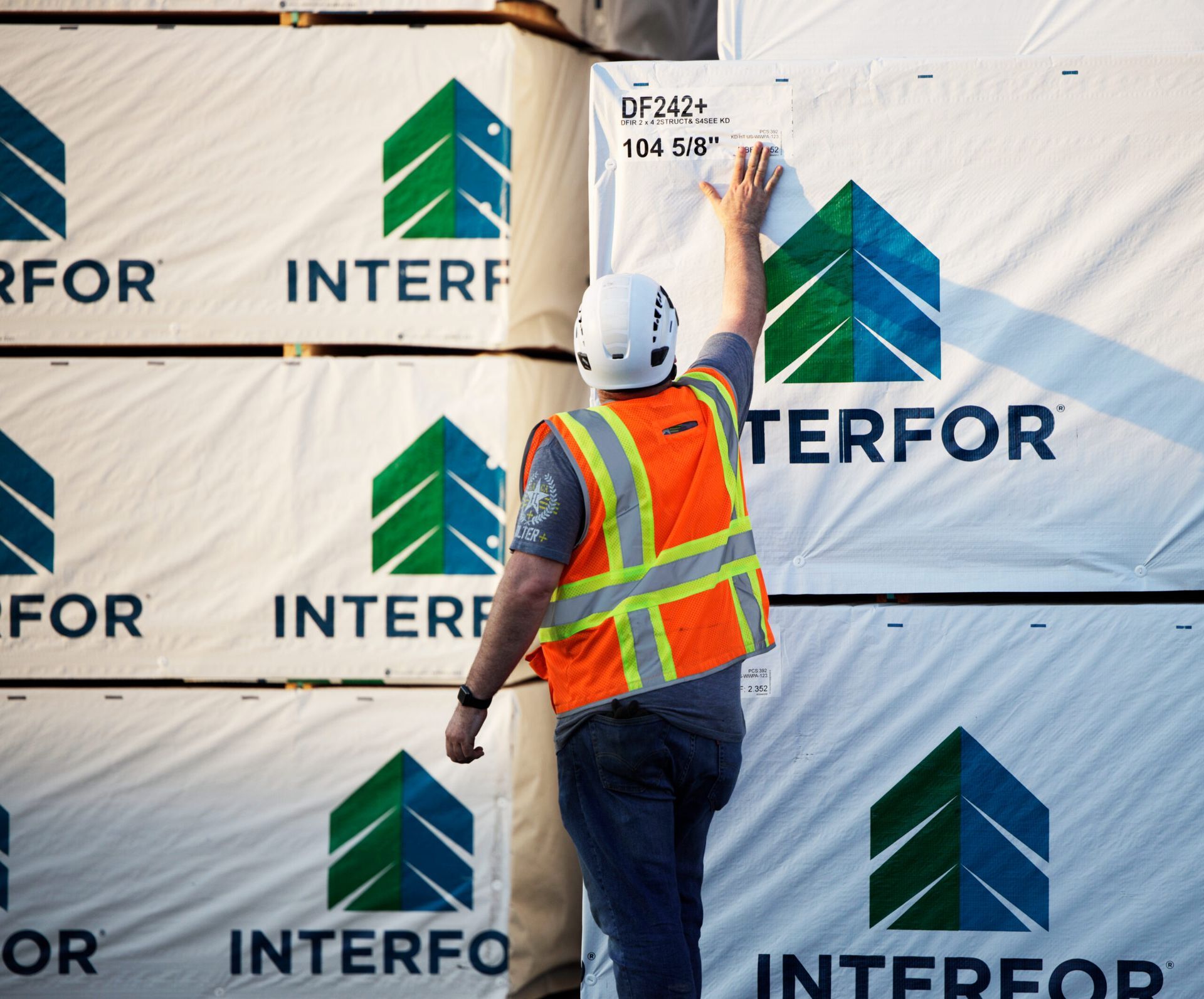 Man stood by an Interfor logo