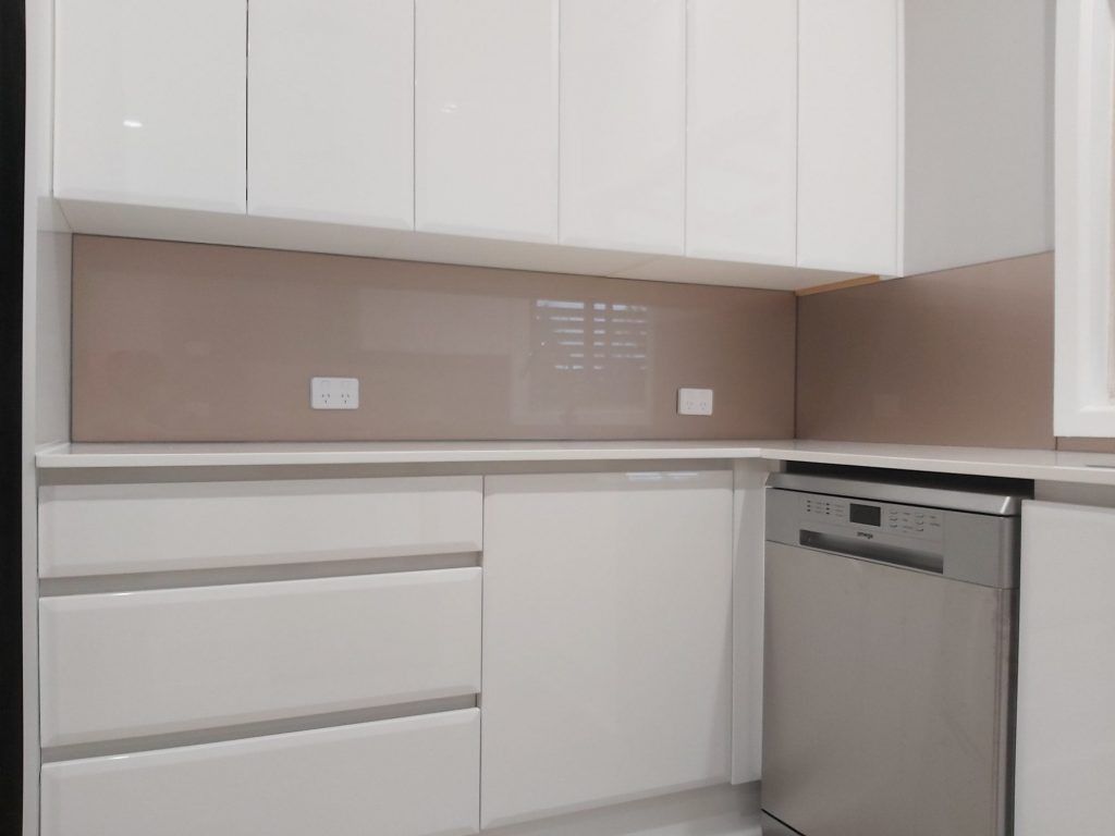 A Kitchen with White Cabinets and A Stainless Steel Dishwasher — DecoGlaze in Cardiff, NSW