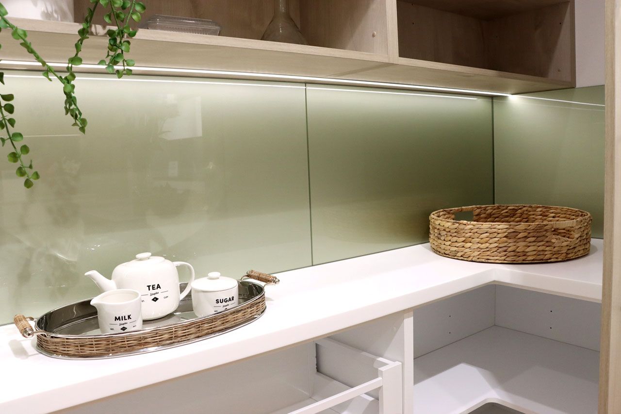 A Kitchen with A Wicker Basket and A Teapot on The Counter — DecoGlaze in Cardiff, NSW