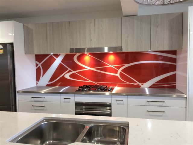 A Kitchen with White Cabinets and Stainless Steel Appliances — DecoGlaze in Cardiff, NSW
