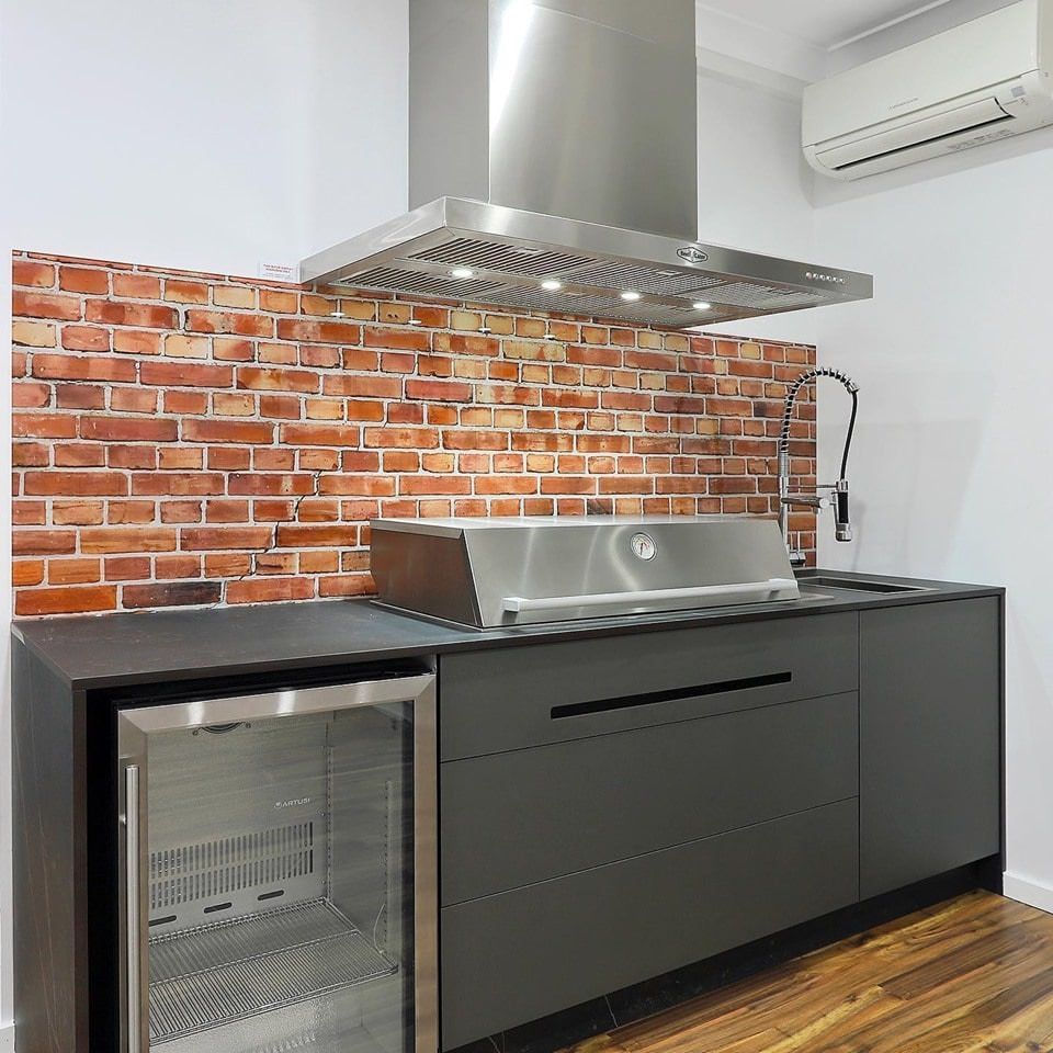 A Kitchen with Wooden Cabinets and Stools and A Coffee Maker — DecoGlaze in Cardiff, NSW