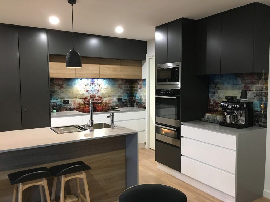 A Kitchen with Black Cabinets , White Cabinets , Stainless Steel Appliances and A Large Island — DecoGlaze in Newcastle, NSW
