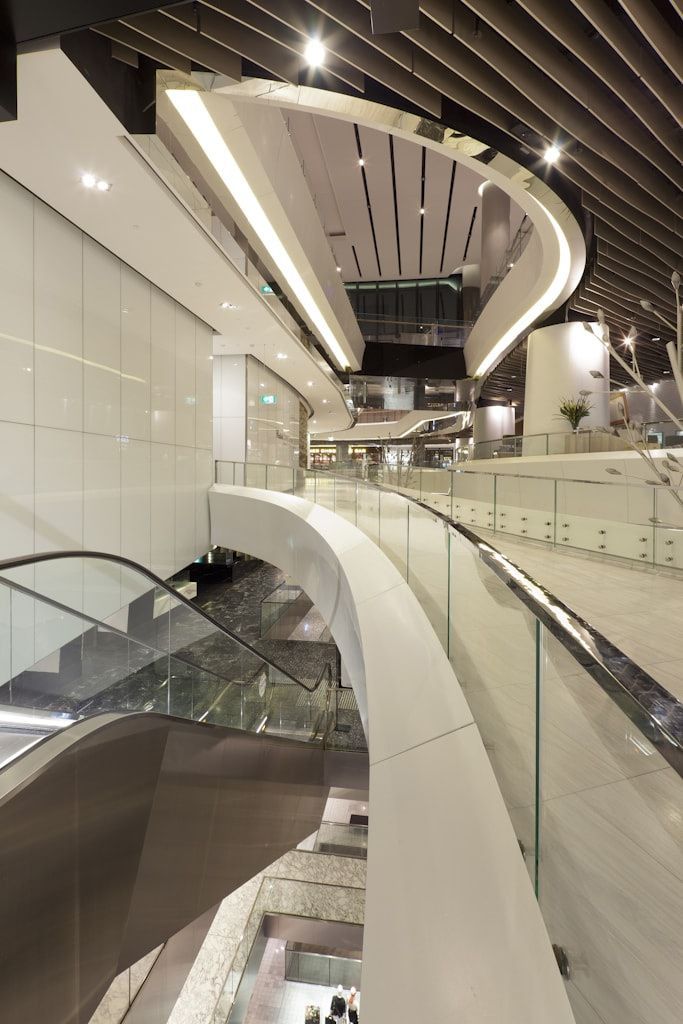 An Escalator in A Building with A Glass Railing — DecoGlaze in Cardiff, NSW