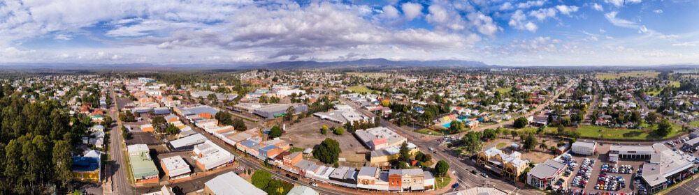 An Aerial View of A City with Lots of Buildings and Trees — DecoGlaze in Cessnock, NSW
