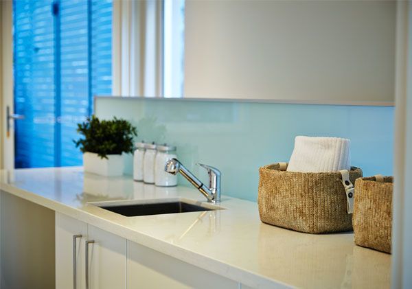 A Kitchen Counter with A Sink and Baskets on It — DecoGlaze in Cardiff, NSW