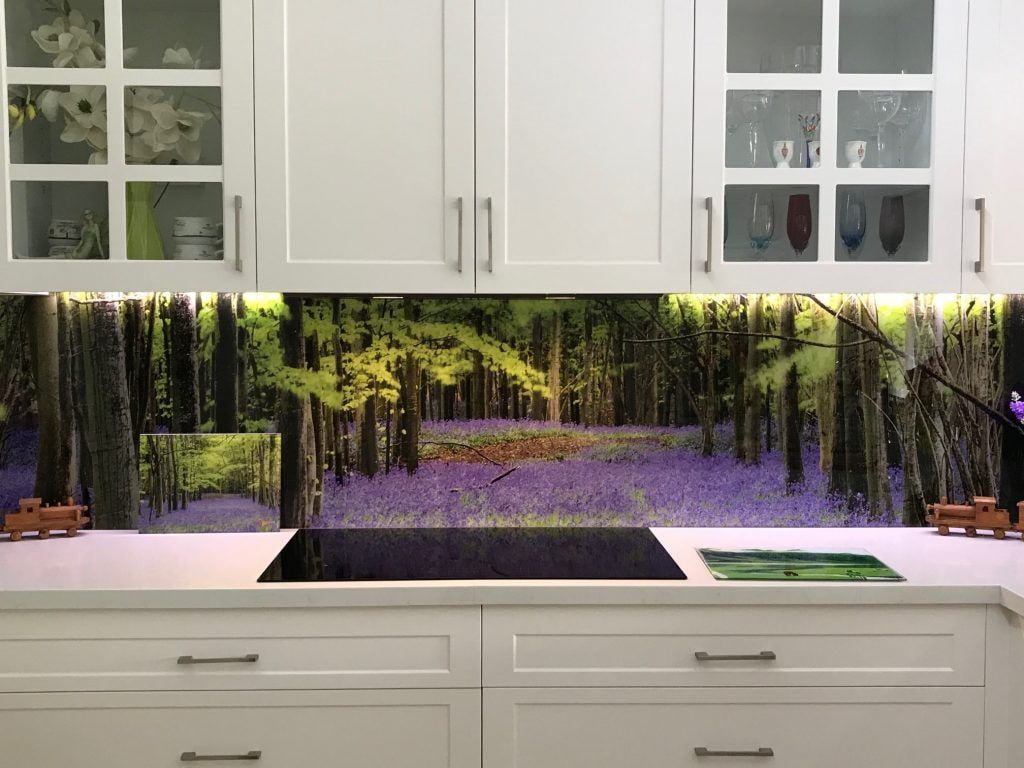 A Kitchen with White Cabinets and A Stove Top Oven — DecoGlaze in Cardiff, NSW