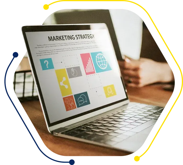 a laptop is open to a page that says marketing strategy