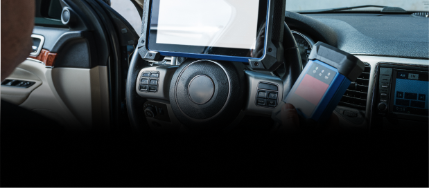 Up close to diagnostics on tablet screen, with the tablet resting on the dashboard of the vehicle | Four Seasons Tire & Auto Service