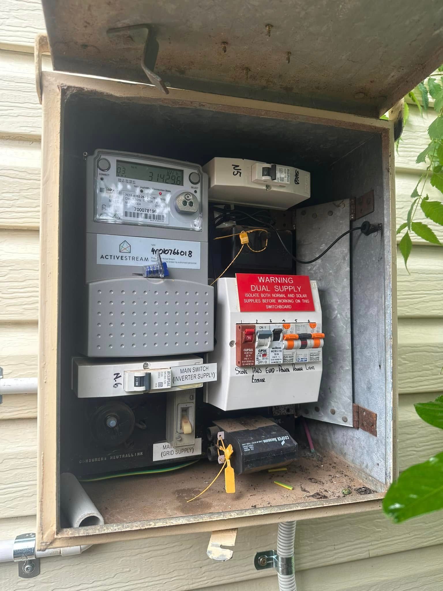 An electrical box with a meter inside of it.