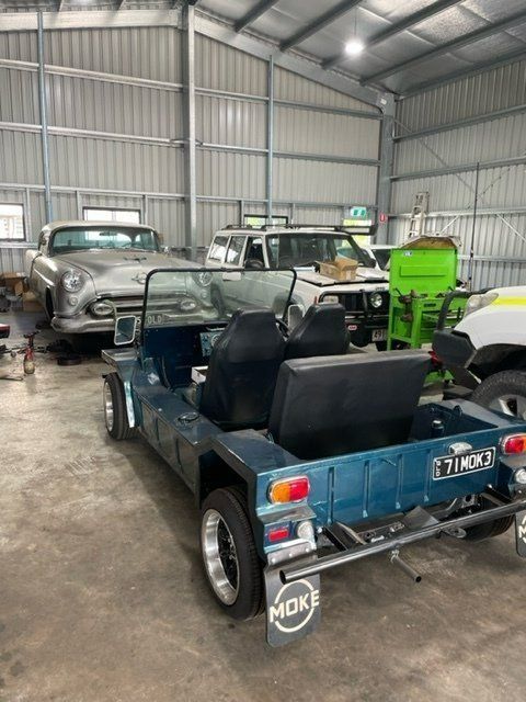 A Blue Buggy Is Parked In A Garage With Other Cars — Ace-Marian In Walkerston, QLD
