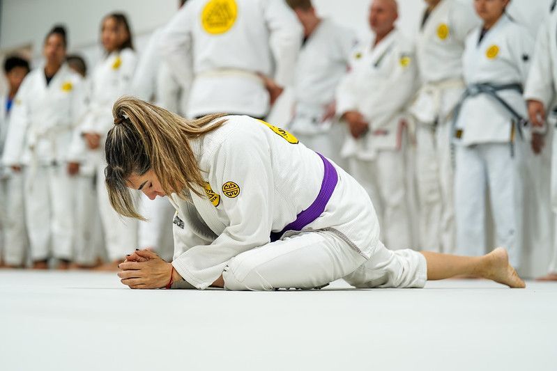 Coach Azul Hartman stretching before training.