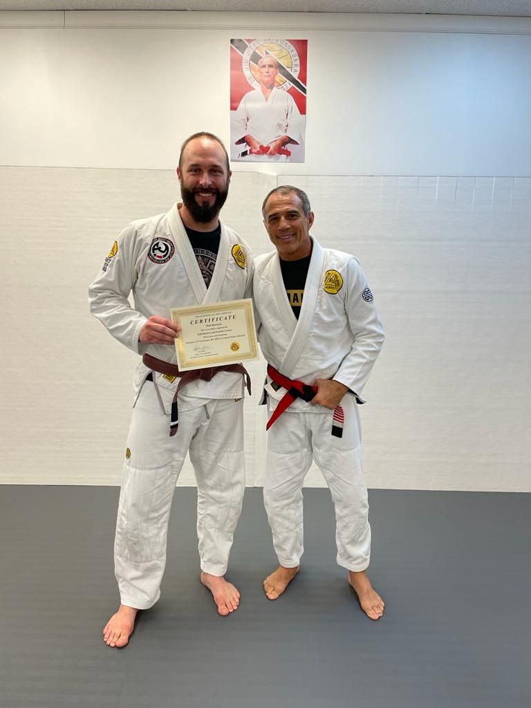 Professor Matt Hartman with Master Royler Gracie after completing, self defense course.