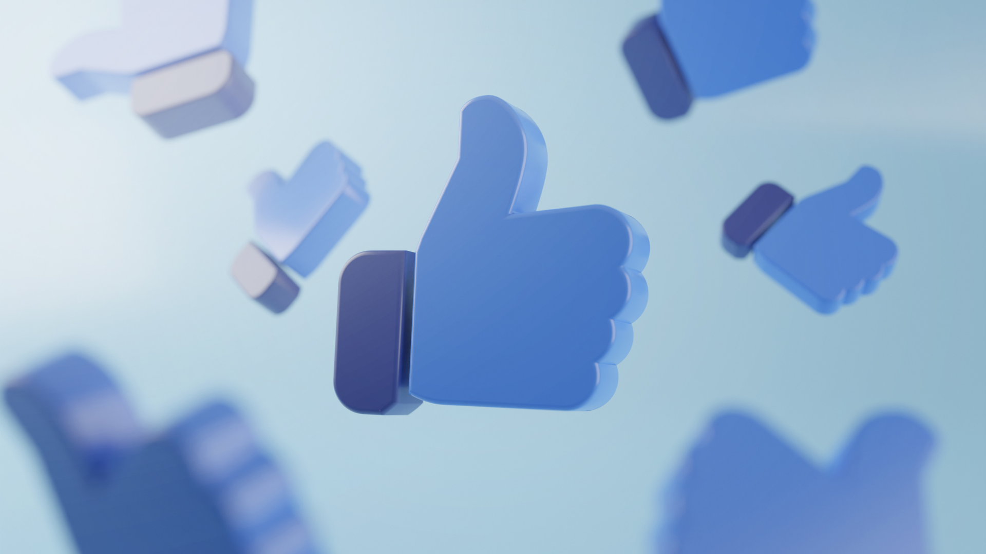 A bunch of blue thumbs up icons are flying in the air.