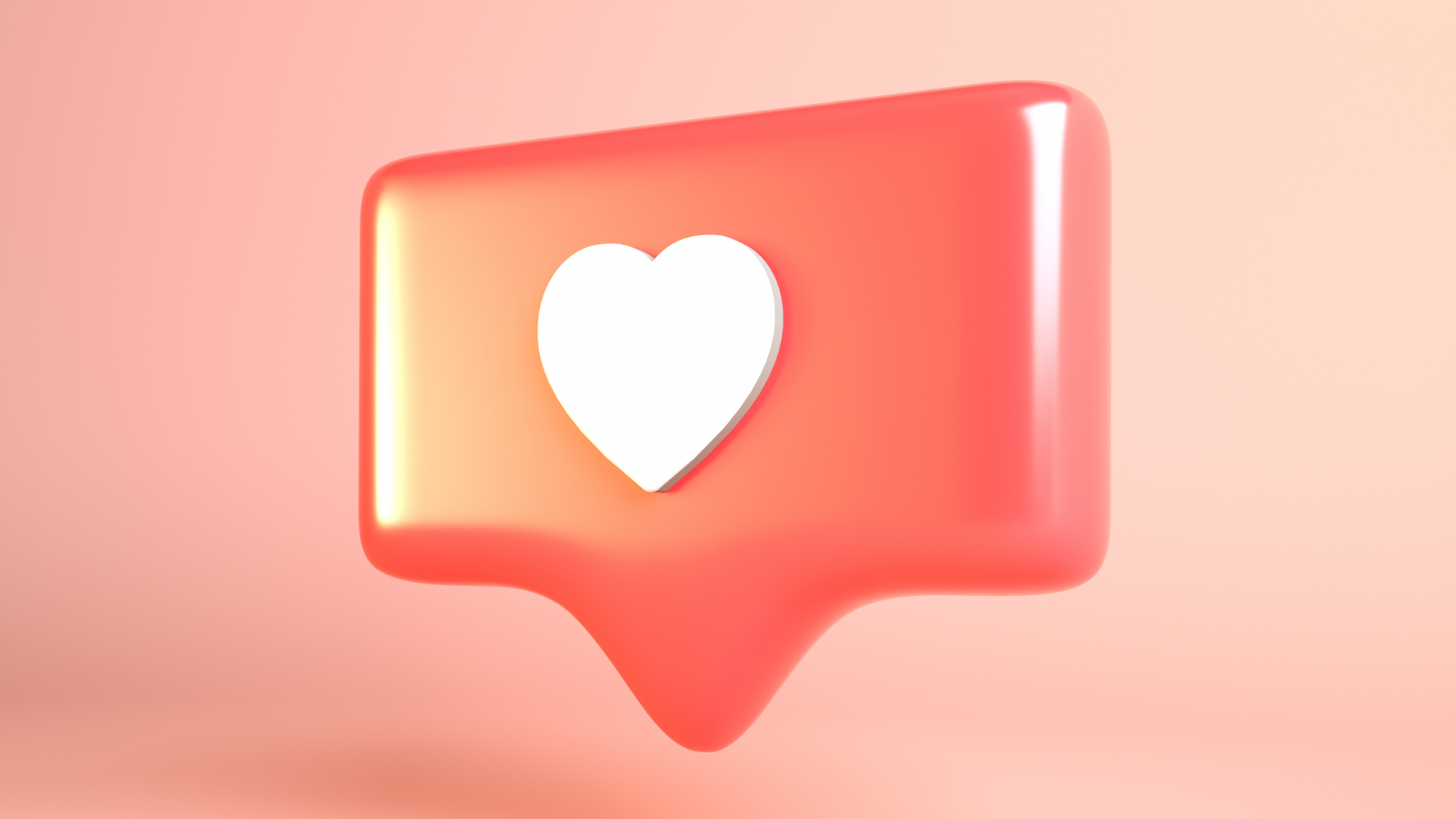 Pink speech bubble with white heart inside, against a pink background.