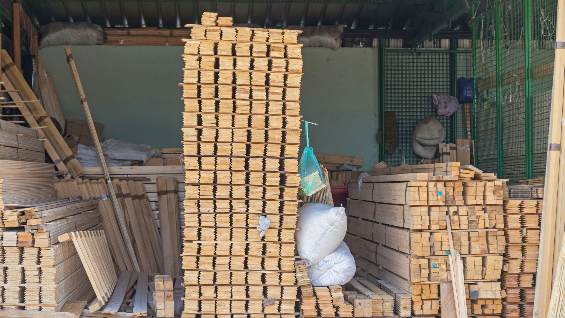 Stacked lumber in a workshop, ready for construction projects in Rockford, IL.