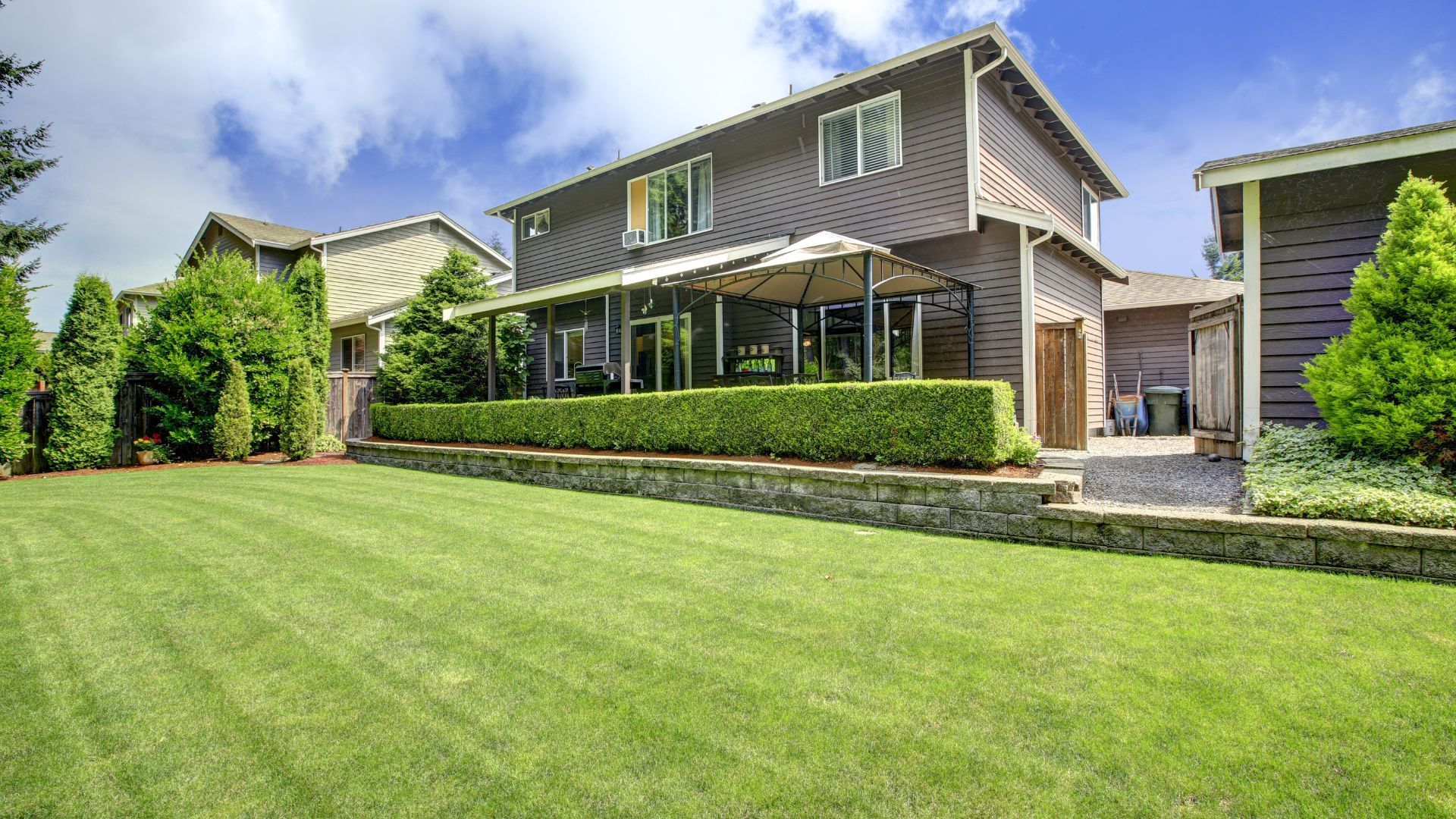 Charming suburban home with a lush, manicured lawn and patio in Rockford, IL.