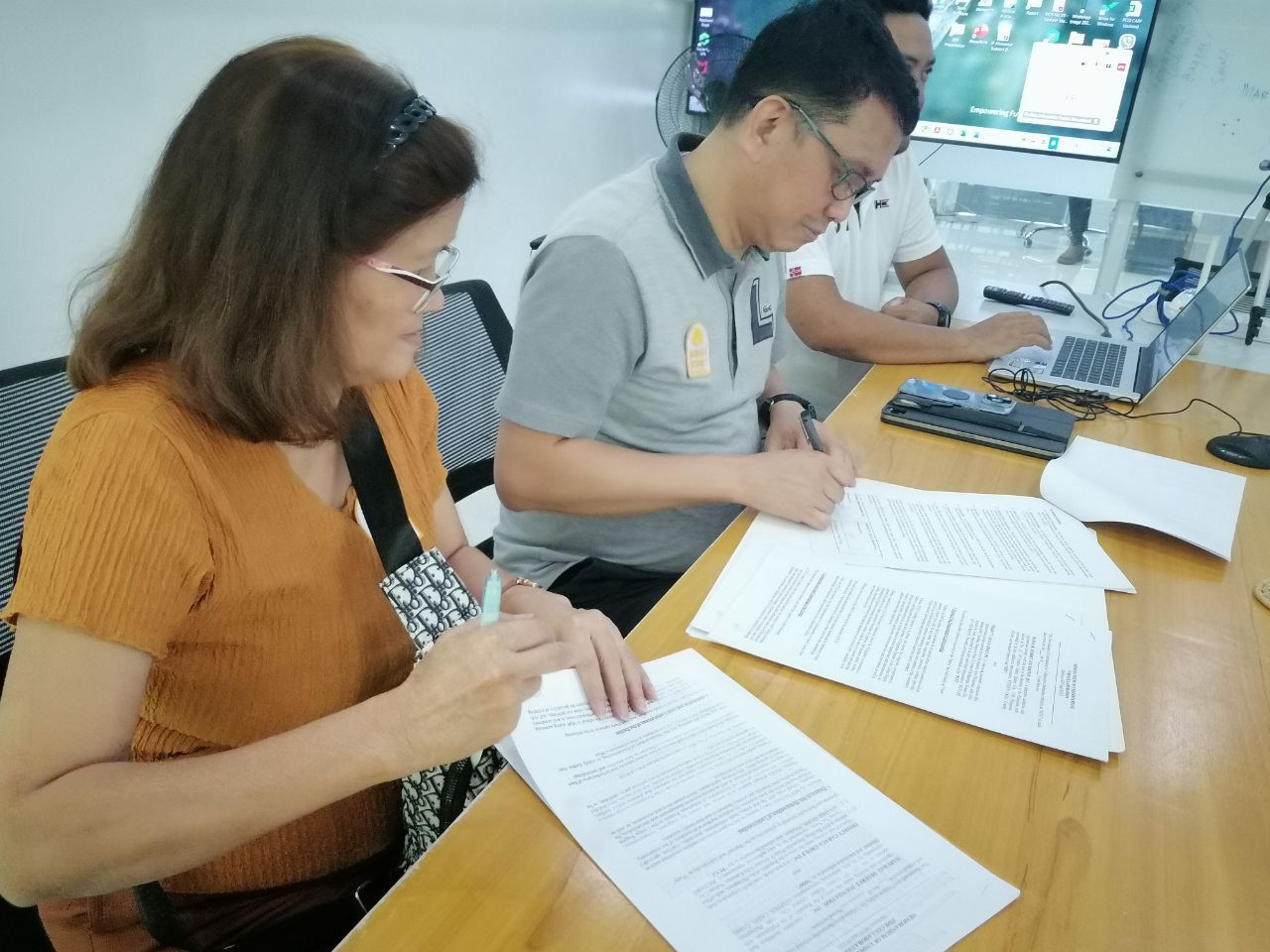Signature panel at MoU signing event for Project Caraga and Mabuhay Deseret Foundation officials