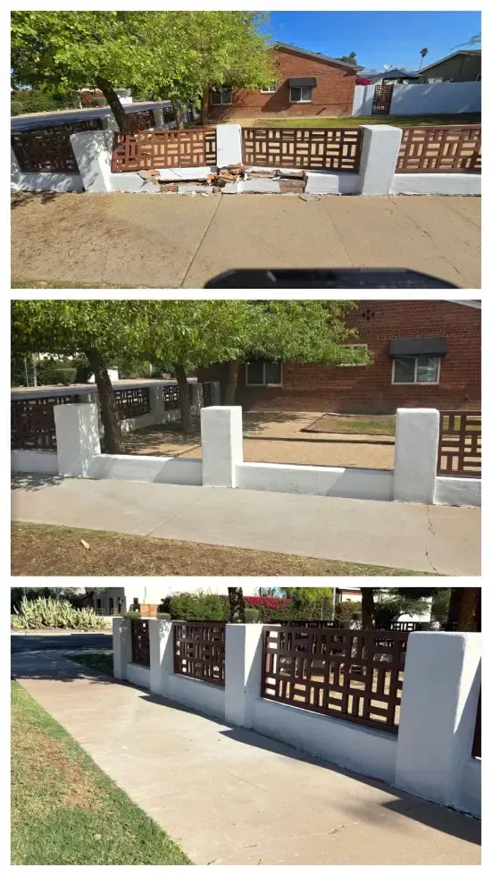 Residential front yard with low white brick fence and decorative metal gate along a sidewalk
