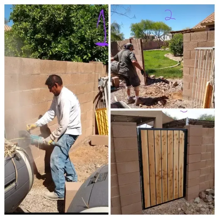 Worker carrying debris and installing a wooden gate in a backyard with block walls.