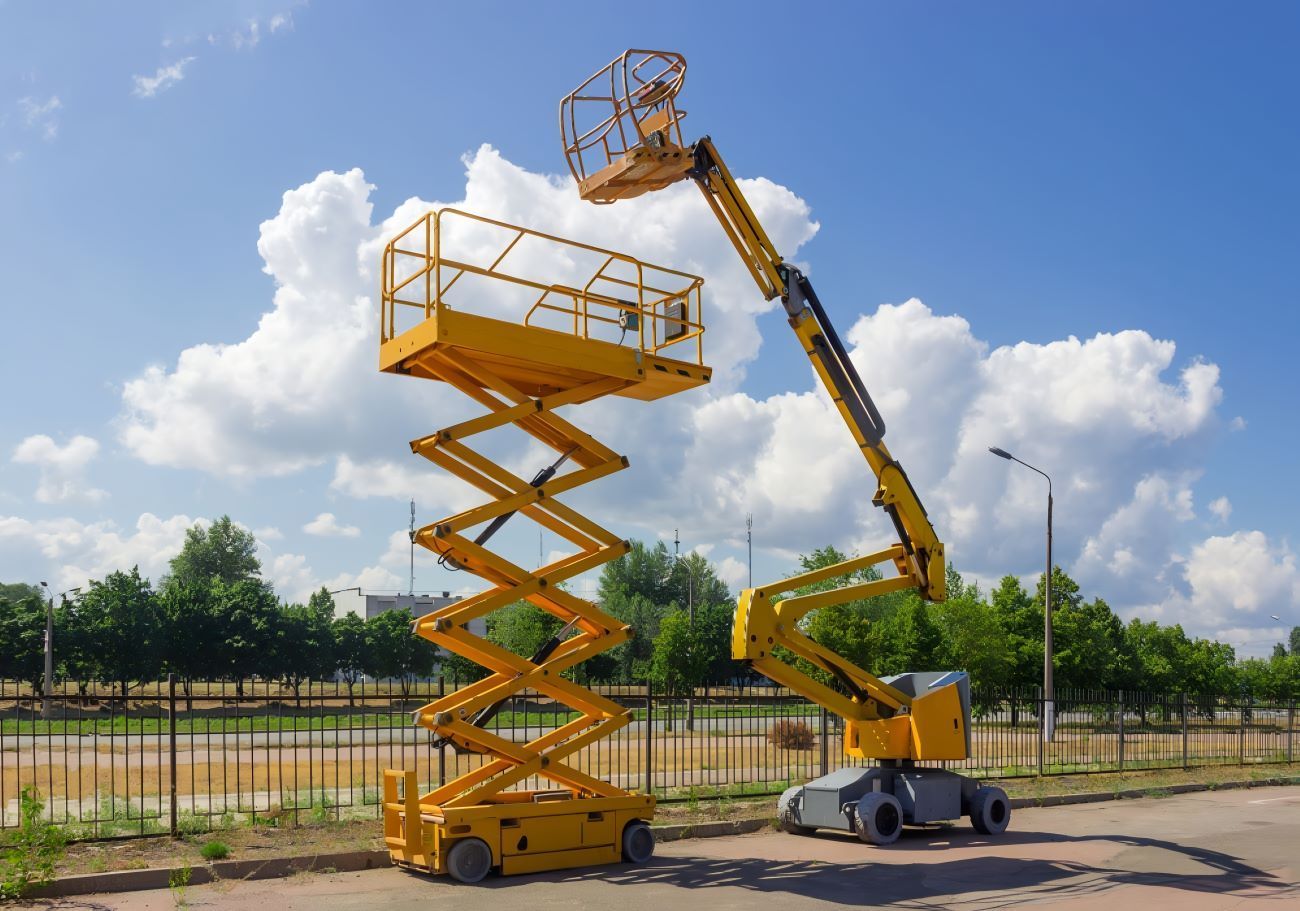 Two Scissor Lifts Are Parked Next to Each Other — Berkeley Vale Hydraulics in Fountaindale, NSW