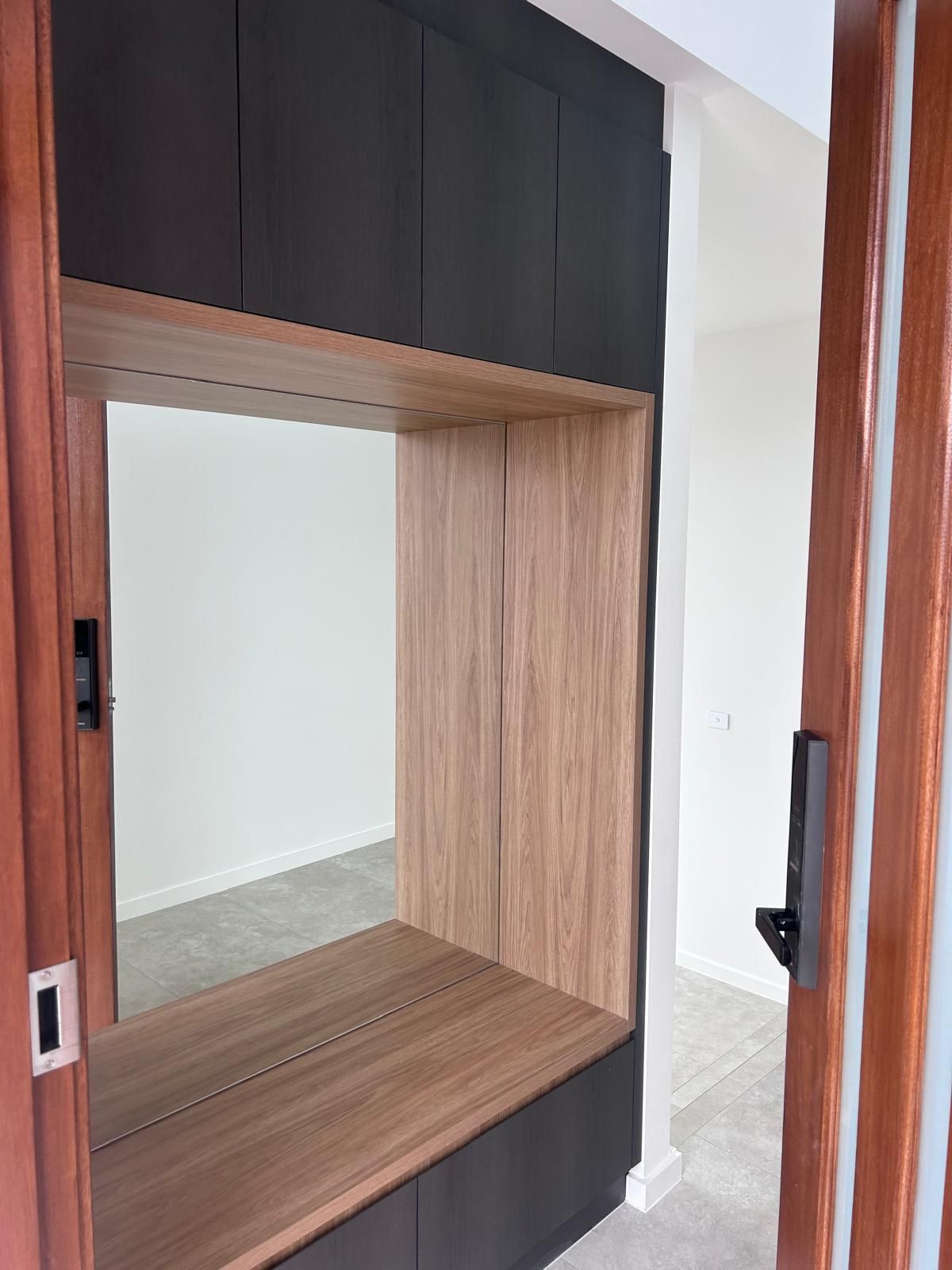 There is a mirror in the middle of the room.