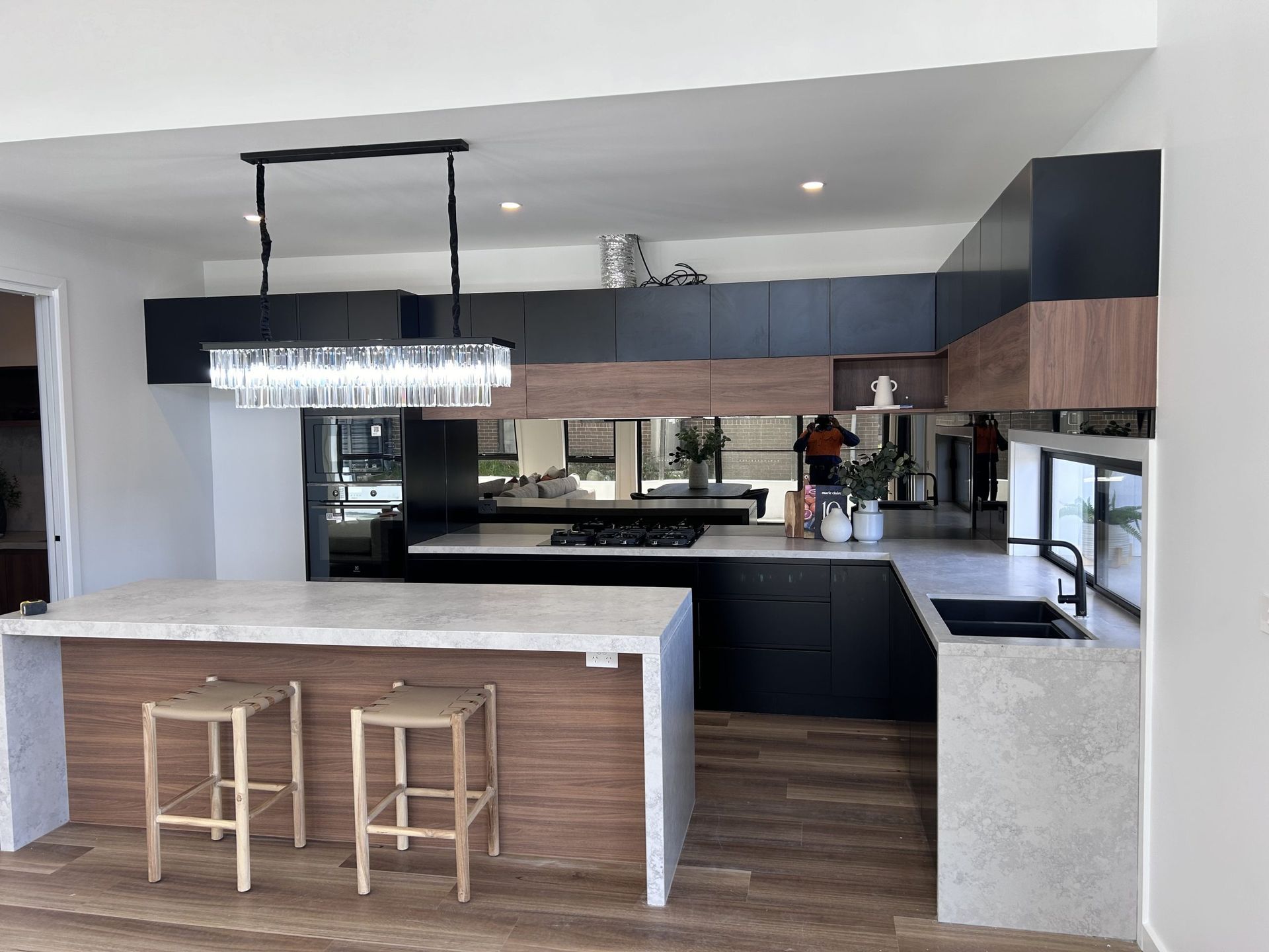 A kitchen with a large island and stools