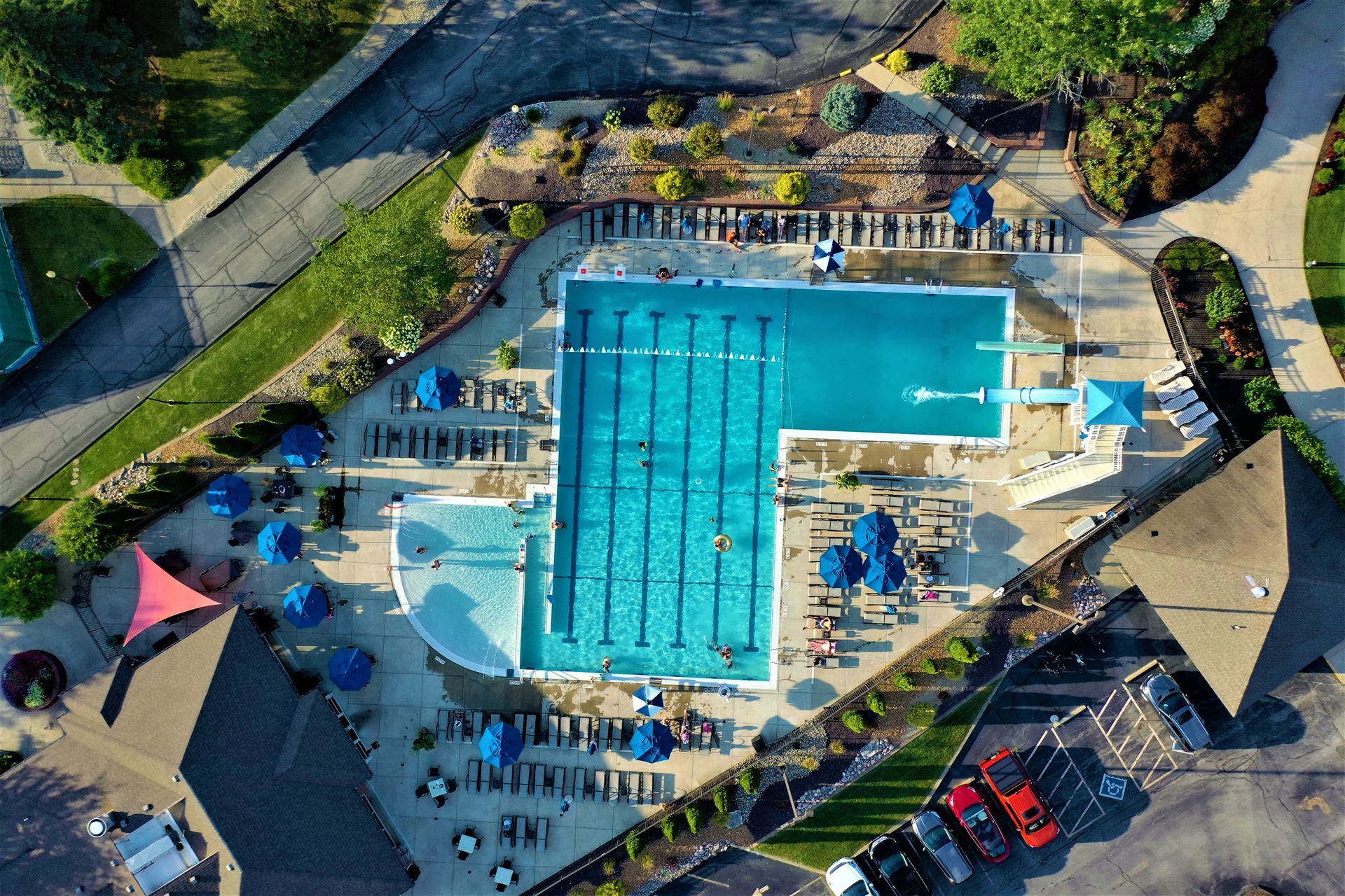 An aerial view of a large swimming pool in a park
