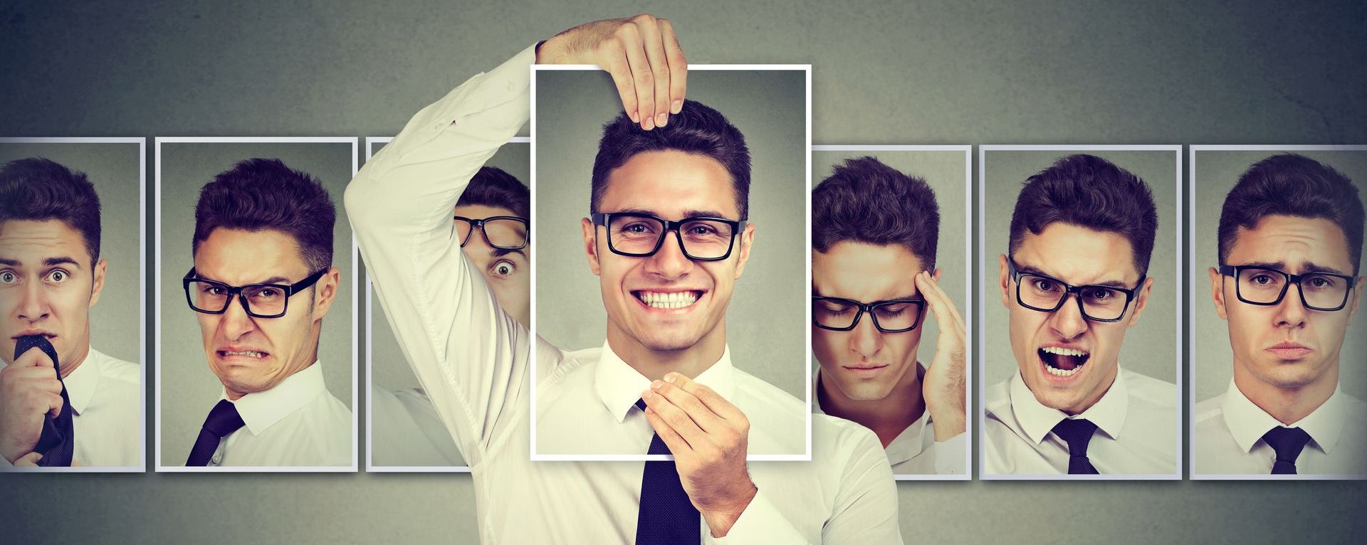 Man holding a picture of himself
