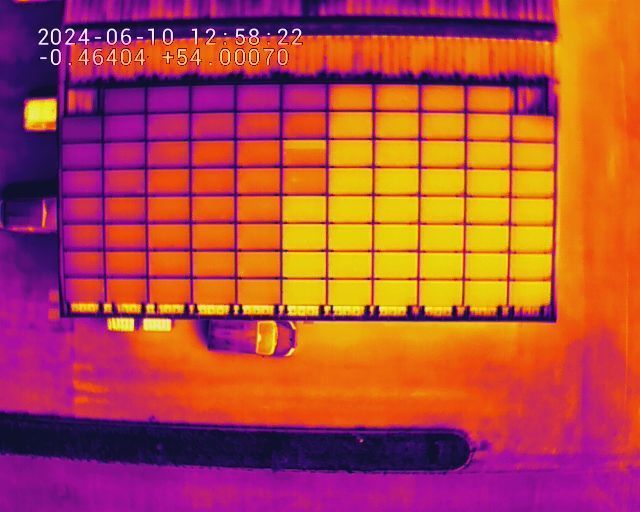 A thermal image of a building with the date 2024