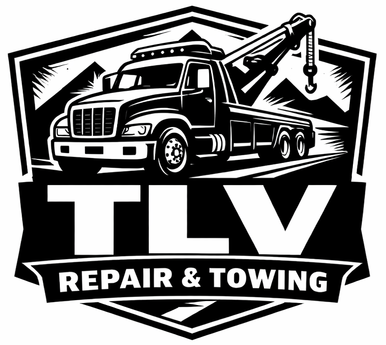 Black and white logo: Tow truck in front of mountains. "TLV Repair & Towing" below.