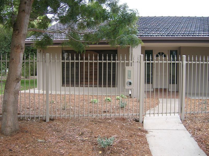 A house with a metal fence around it