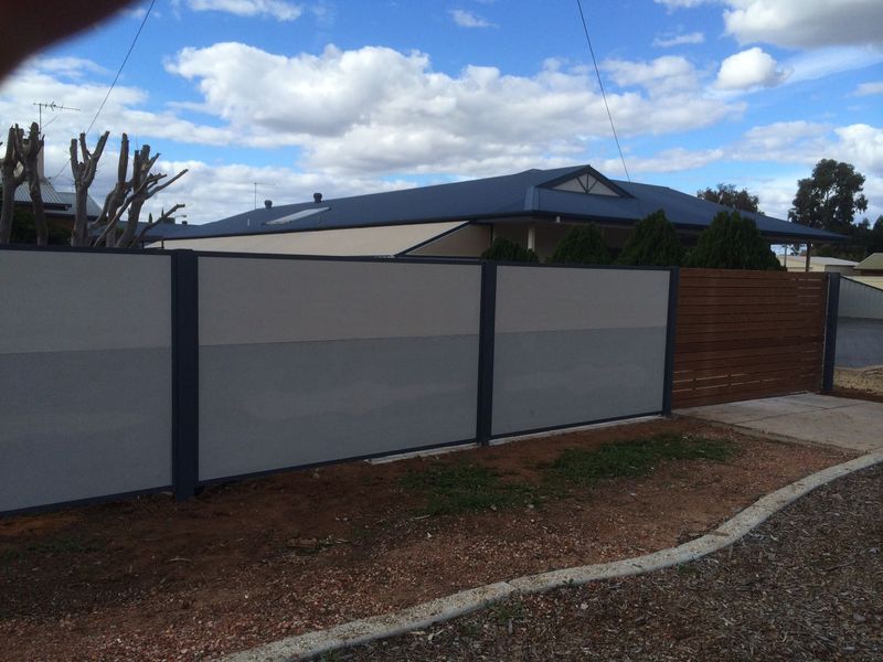 A house with a fence in front of it