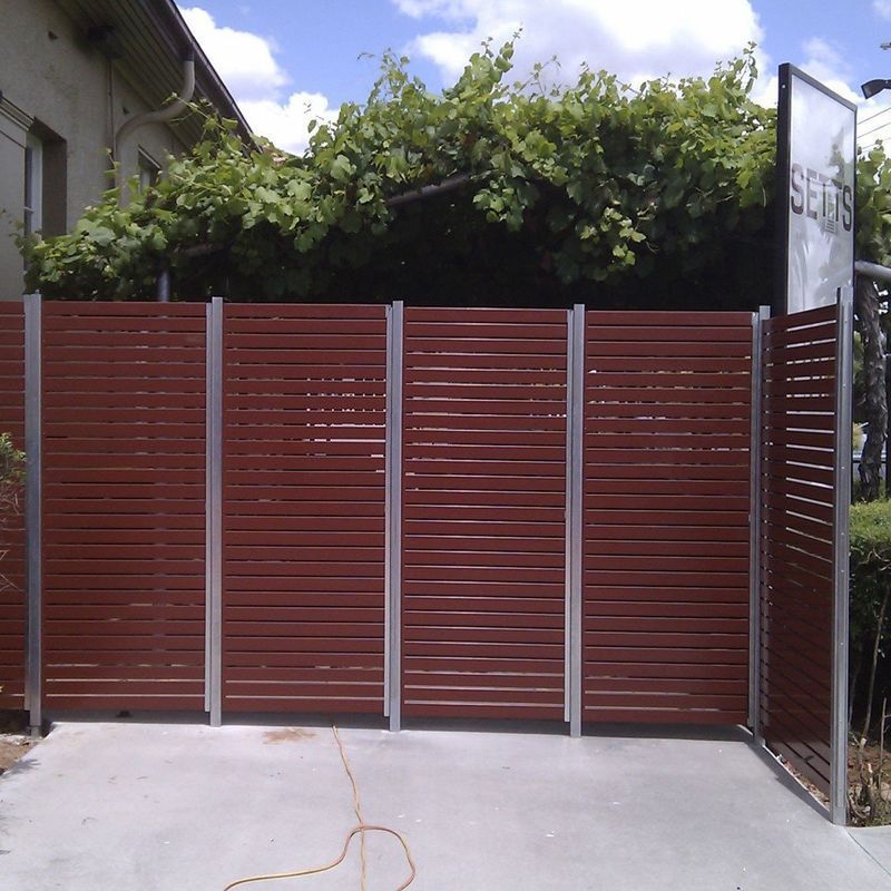 A wooden fence with a sign that says seeds on it
