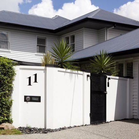 A house with the number 11 on the side of it