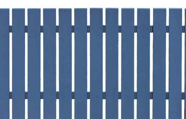 A blue wooden fence with white stripes on a white background.