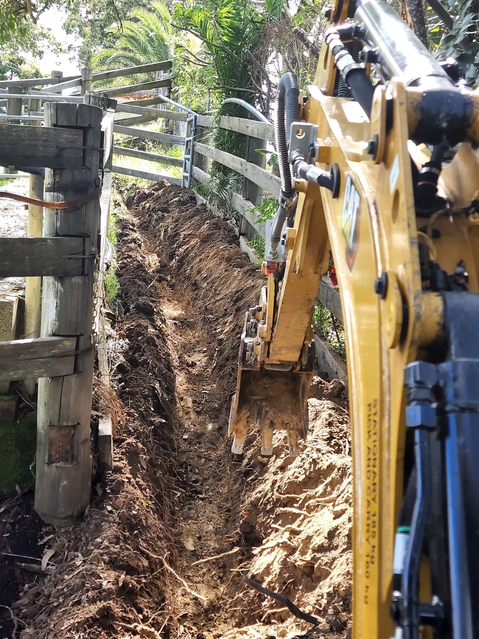 Working Excavator Tractor Digging A Trench — CHT Excavation and Hire In Wherrol Flat NSW