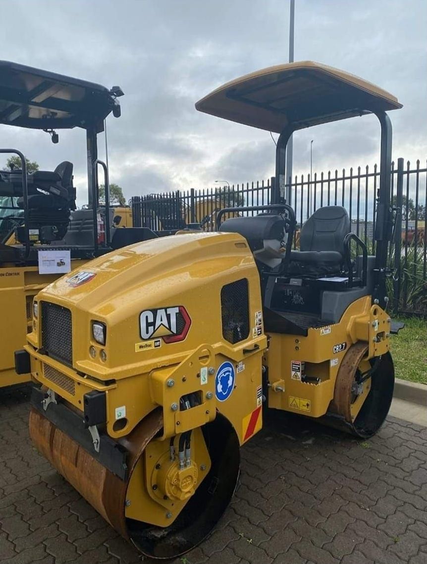 Large Excavator Stands In The Middle Of The Street Near The Dug Hole — CHT Excavation and Hire In Wherrol Flat NSW
