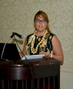Dr. Henderson speaking at a conference in Maui