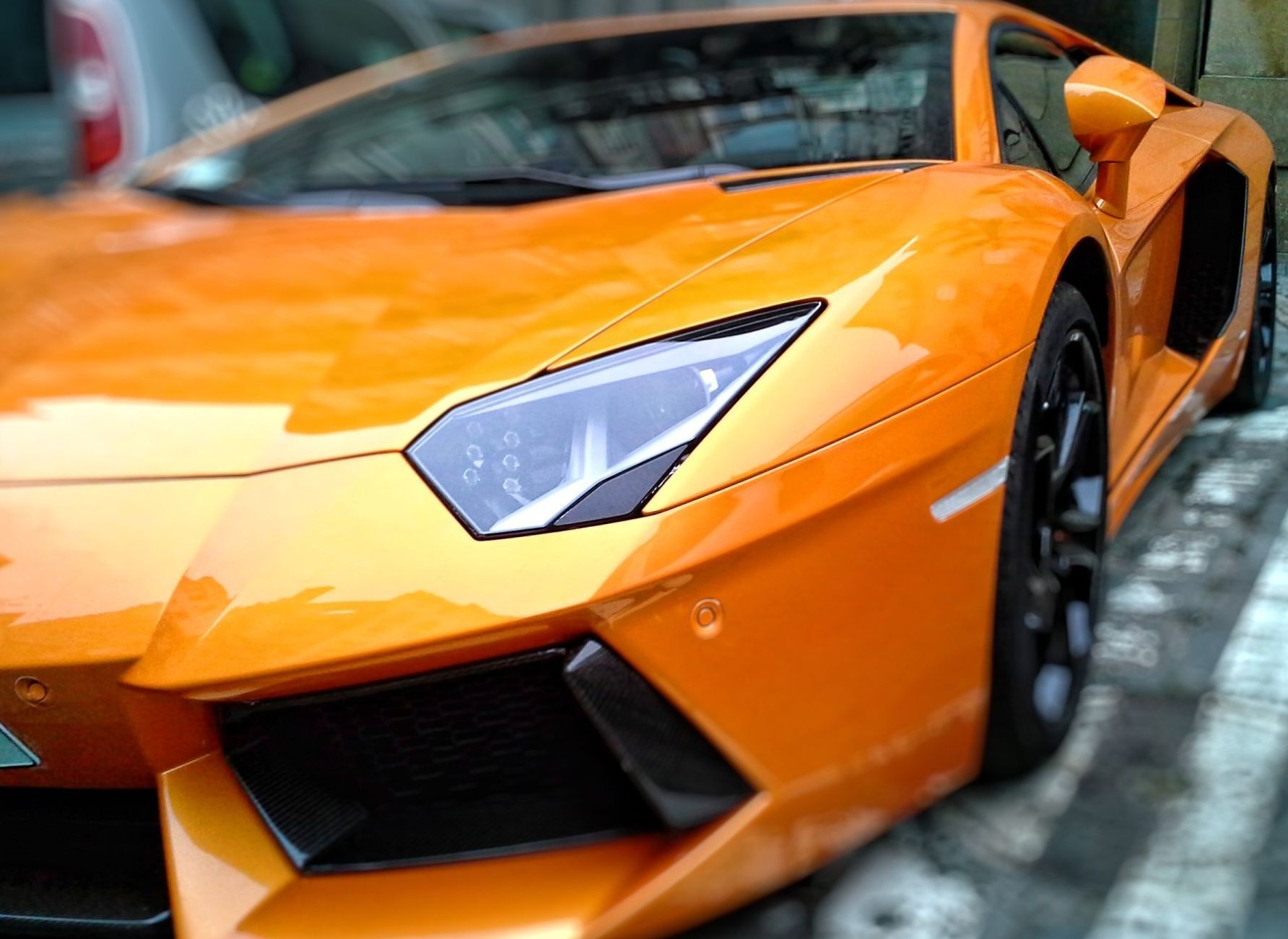 picture of a very shiny yellow supercar