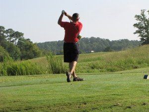 Golf player swinging club