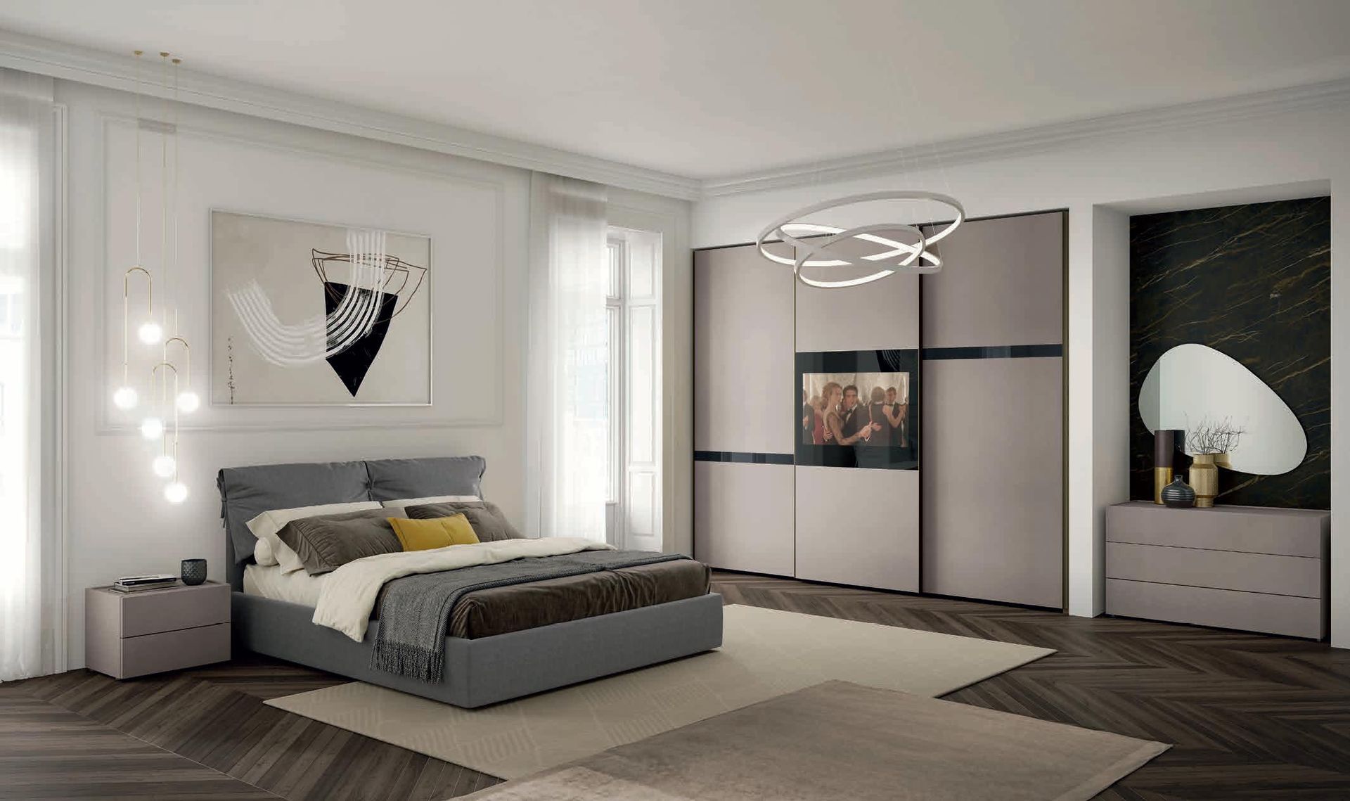 Una camera da letto con un letto grande e una televisione sul muro