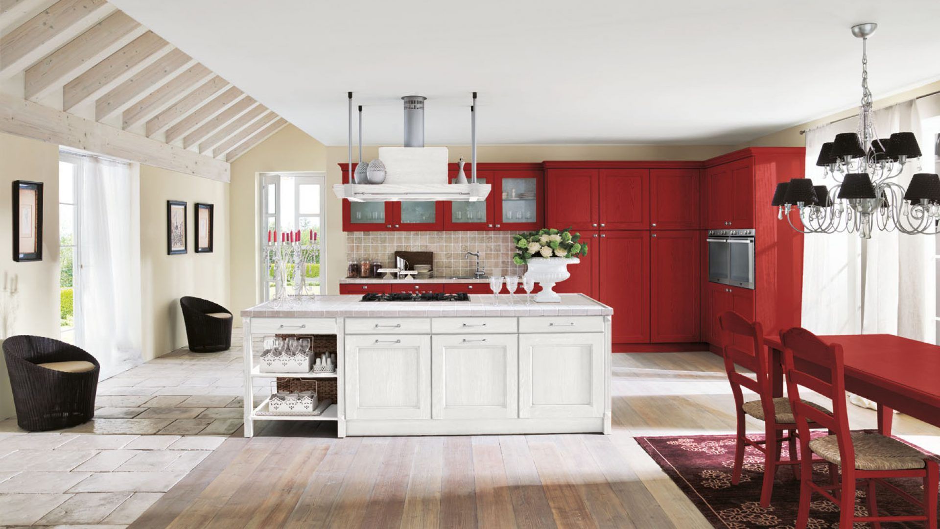 Una cucina con mobili rossi e mobili bianchi