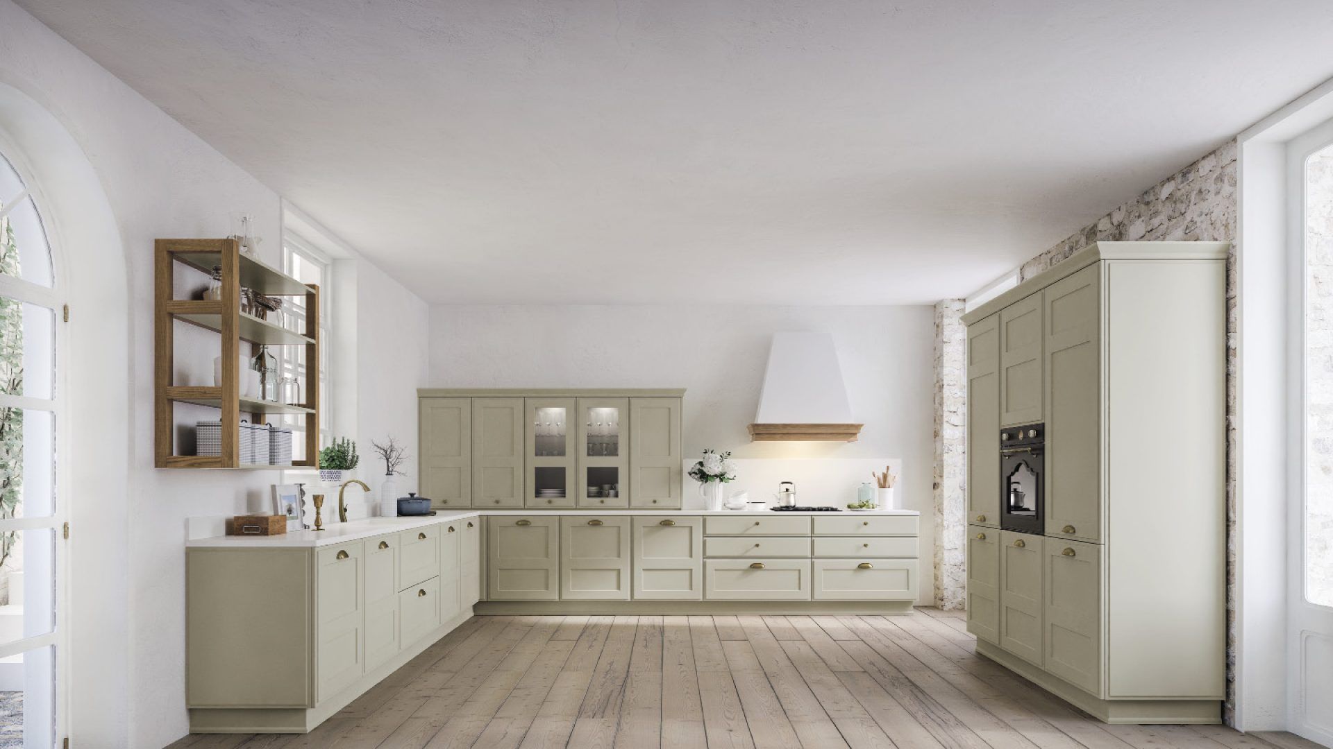 Una cucina con mobili bianchi e pavimenti in legno